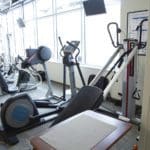 interior of a gym with tall windows from floor to ceiling