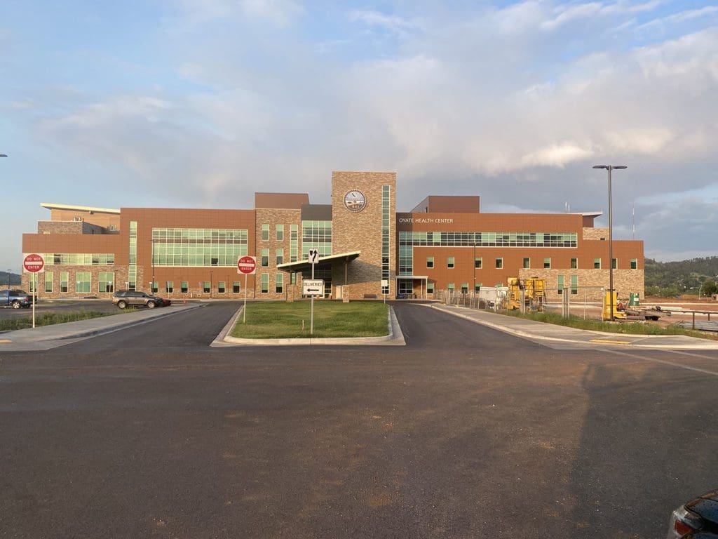 Oyate Health Center building and parking lot entrance